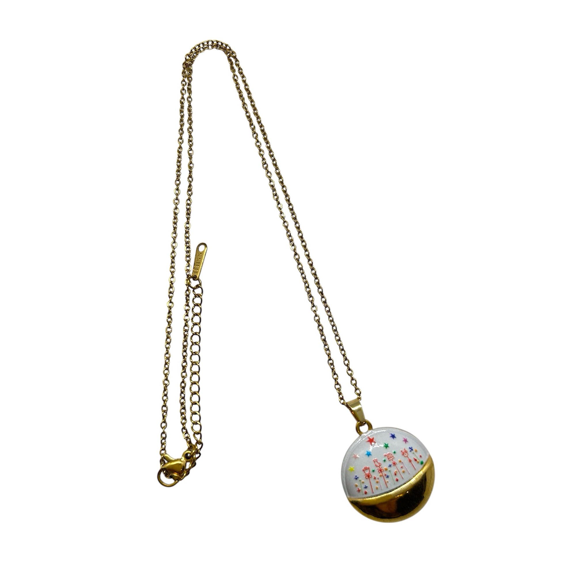 Gold steel necklace with christmas scene.